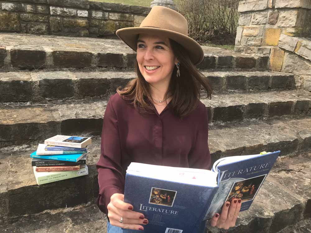 woman with a literature study book for creative writing tutoring